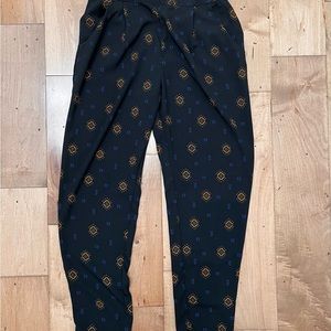 Divided size 10 navy pant w/ design in good condition. Pockets and band waist.